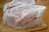 Dry-aging the beef in cheeses-cloth