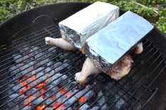 Weigh chicken down using pre-heated bricks